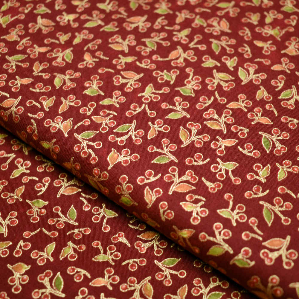 Tela en fondo rojo con motivos de navidad