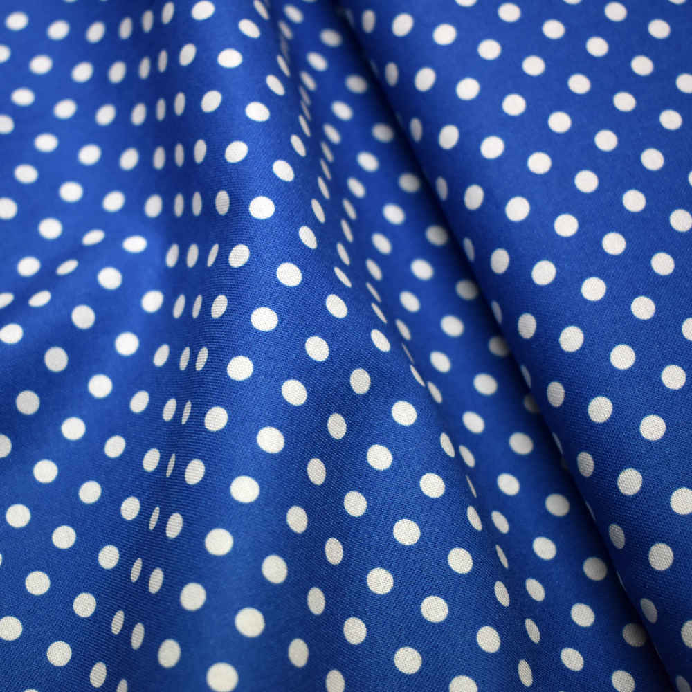 Tela de topos blancos con fondo azul. Stof Fabrics. Color 861