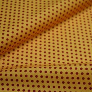 Tela de topos rojos sobre fondo amarillo. COATS. PWZZ007. GOLD