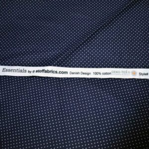 Tela de topos blancos con fondo azul. Stof Fabrics. Color 882