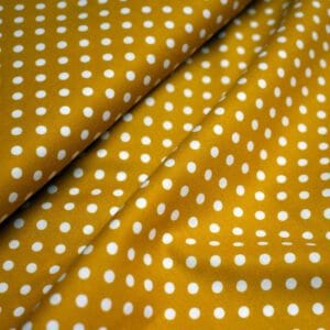 Tela de topos blancos con fondo mostaza. Stof Fabrics. Color 679